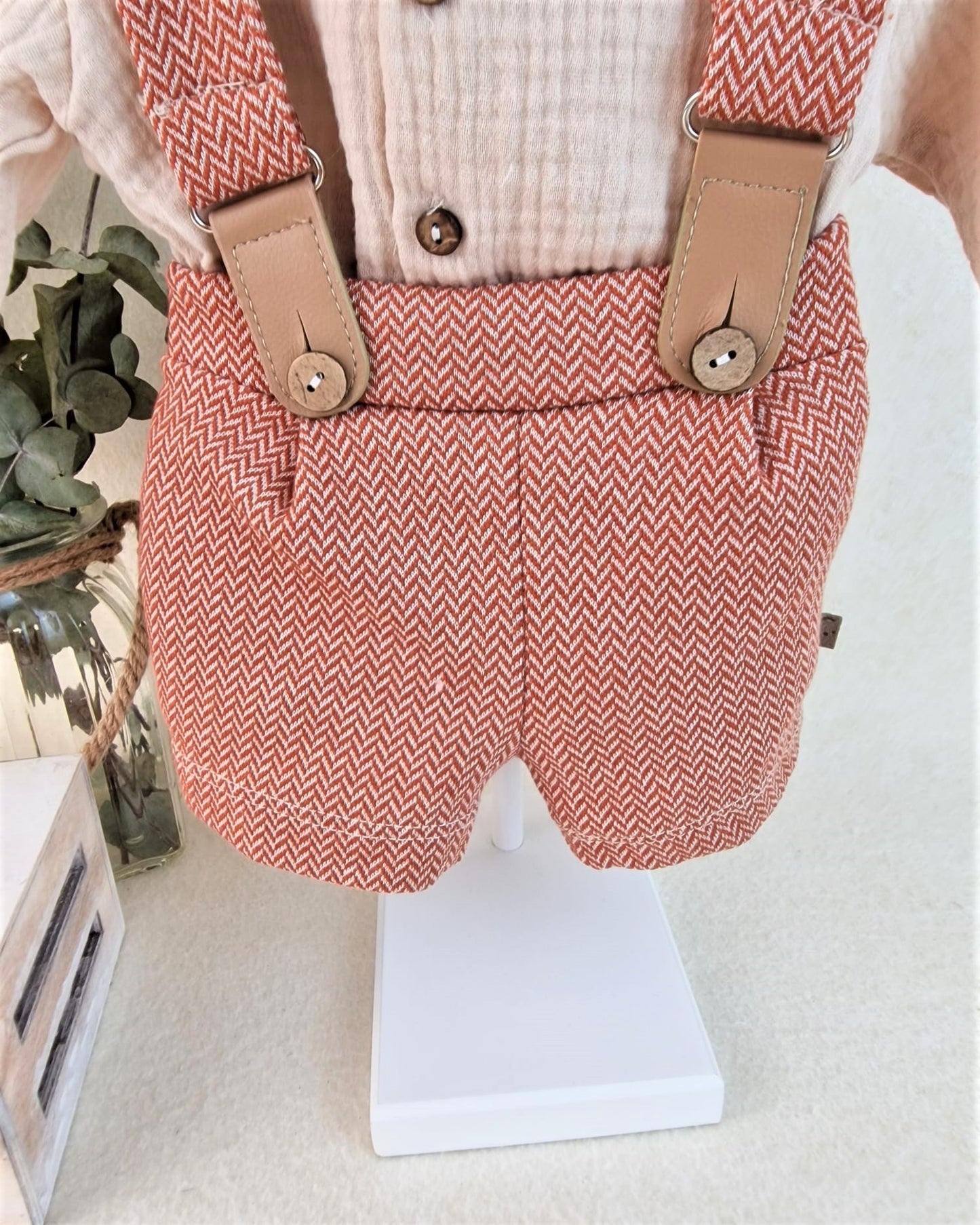Conjunto con peto Orbis