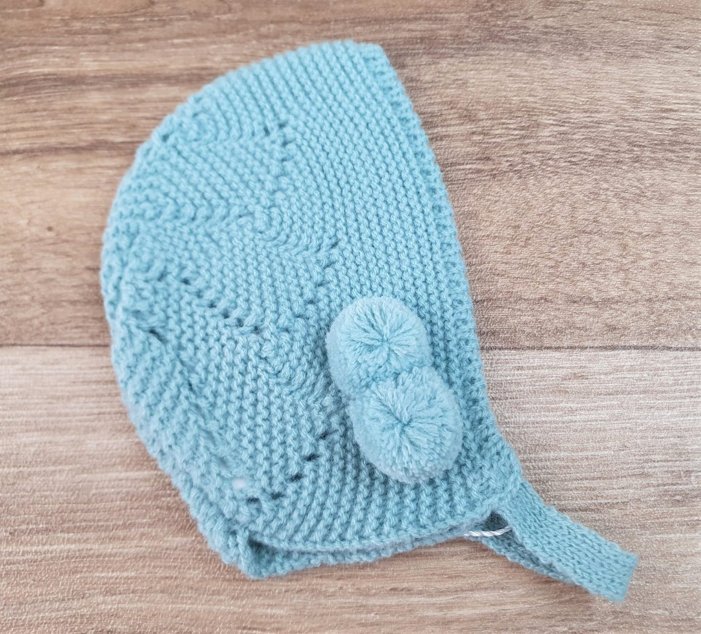 Capota bebe pompón