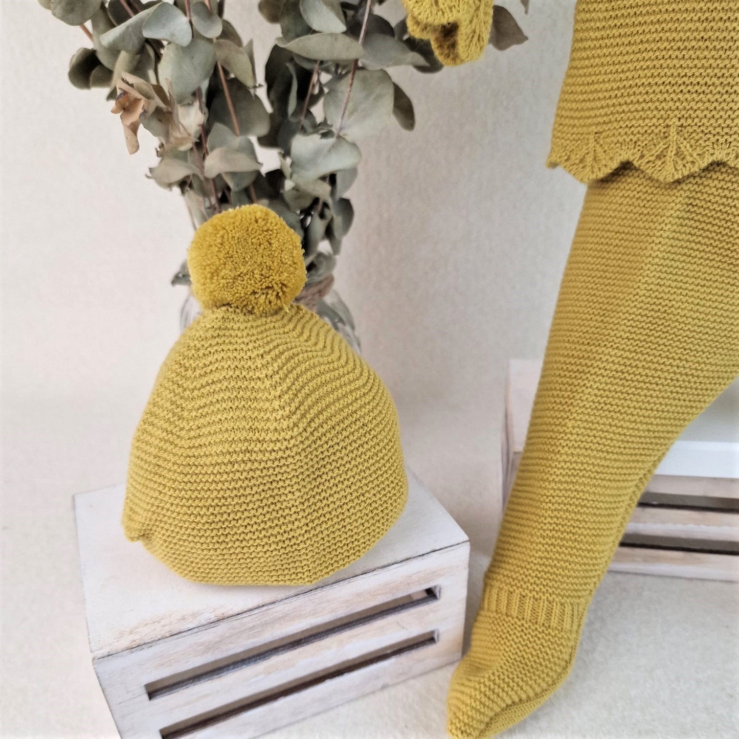 Conjunto con polaina y capota con rombos y bodoques