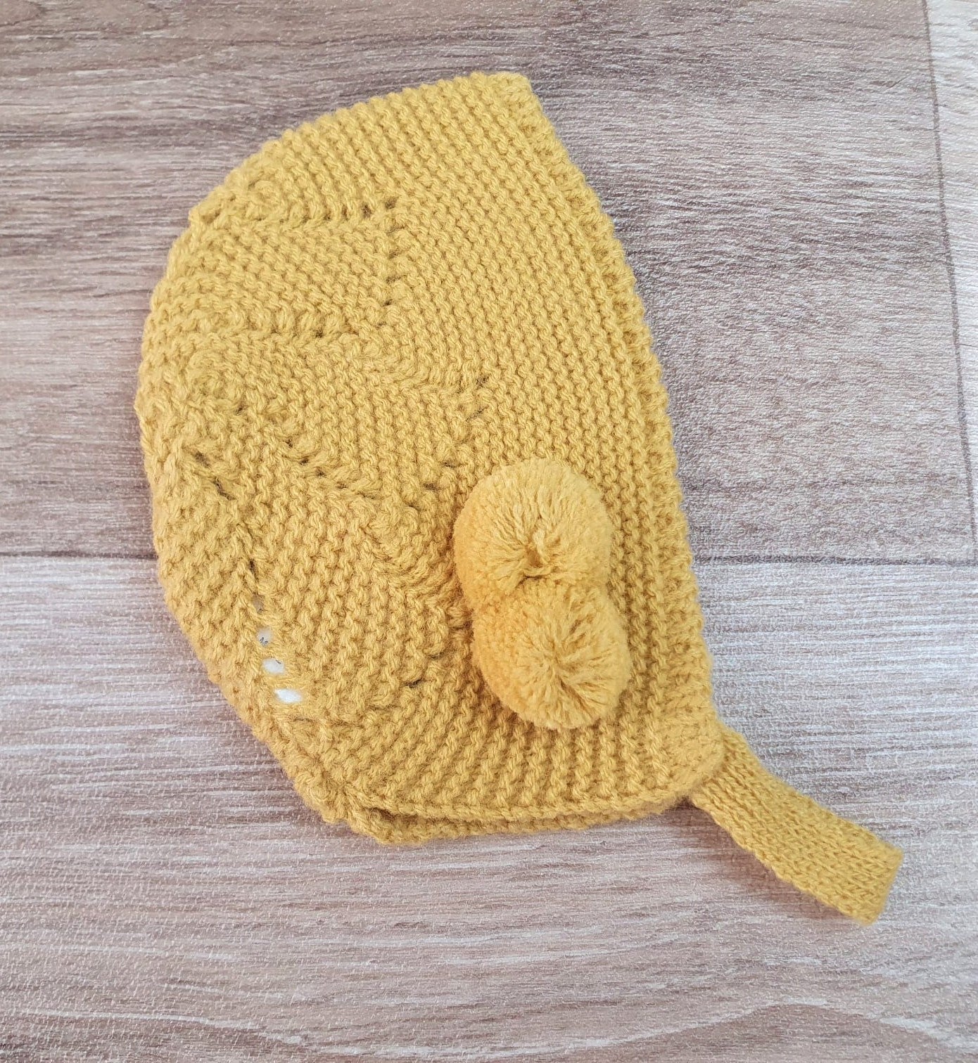 Capota bebe pompón